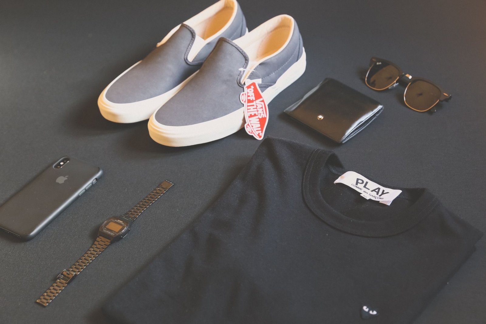 a pair of dark gray pouch boxer briefs laid flat with a tailor's tape measuring the inseam line